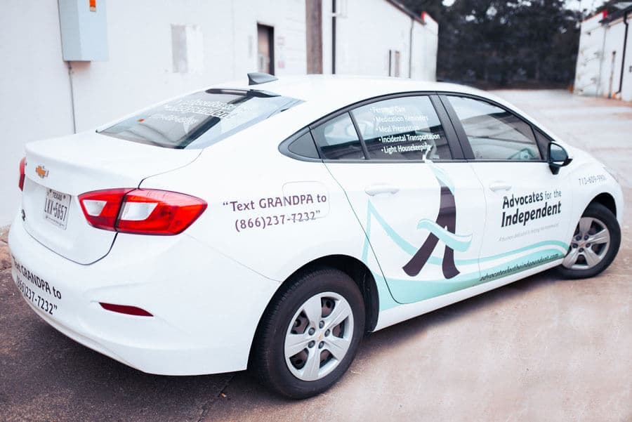 Car wrapped with Advocates for the Independent company logo